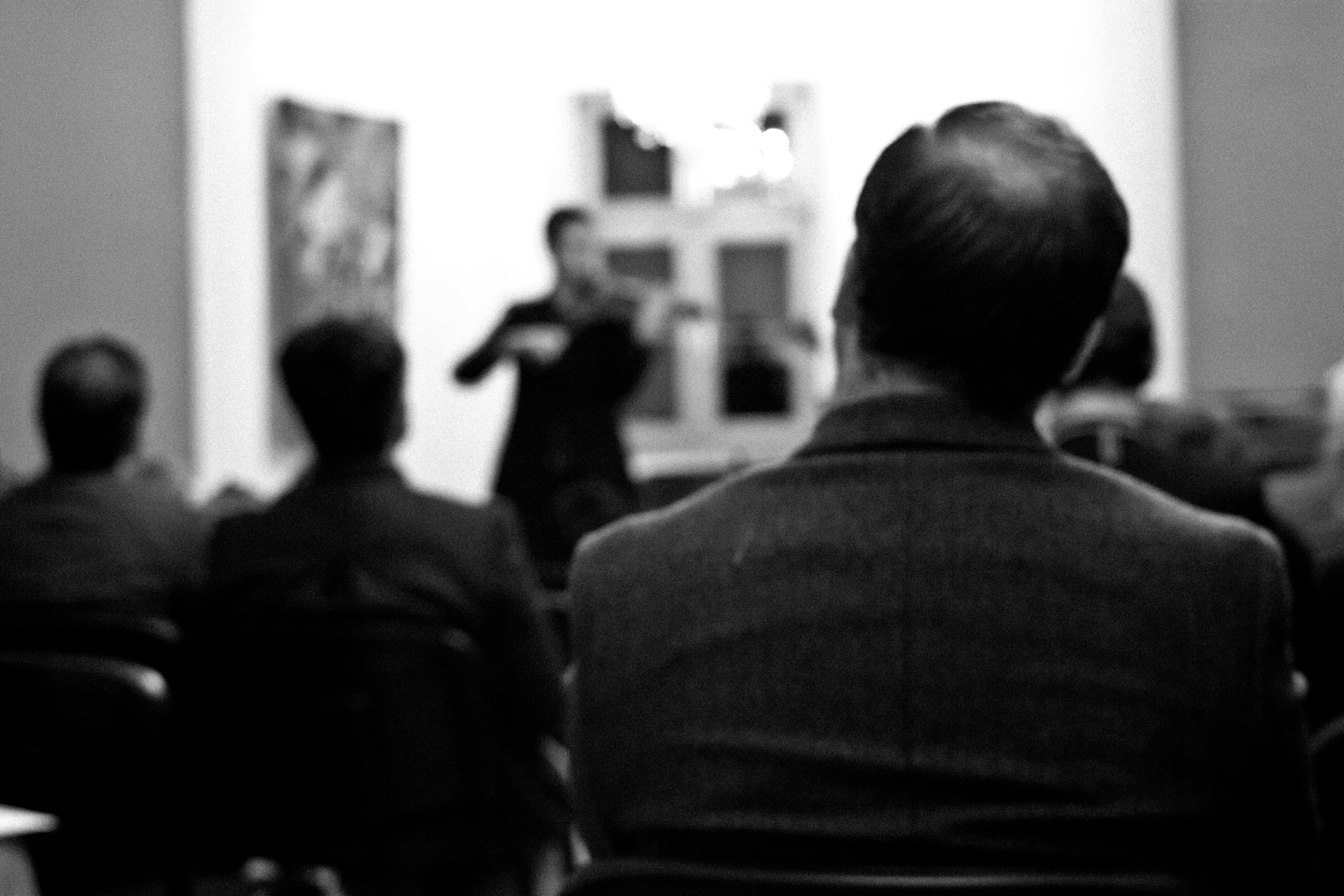 ITI students and staff listen to violinist Tudor Andrei in Sts. Cyril and Methodius Hall