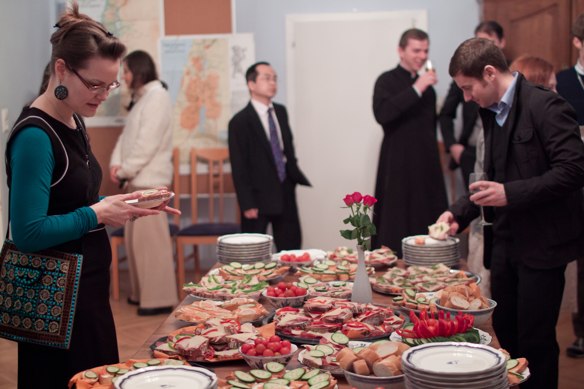 Students and staff begin the evening's celebrations with an agape in Moses Hall